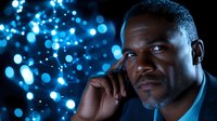 Professional African American businessman talking on phone with blue bokeh lights background for corporate communication concepts.