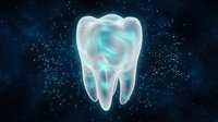 Glowing translucent tooth with swirling energy patterns against starry space background for dental care and oral health concepts.