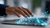 Hand typing on digital keyboard with glowing blue light effects and particles, modern technology concept for business innovation and digital transformation.