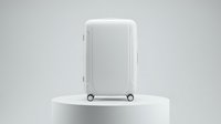 White hardshell carry-on suitcase with spinner wheels on a round podium, minimalist studio background, travel and luggage concept.
