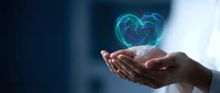 Hands holding glowing digital heart symbol representing healthcare technology, medical innovation, and compassionate care in modern medicine.