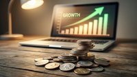 Stacked coins on wooden desk with laptop displaying growth chart and upward arrow, symbolizing financial success and business investment returns.