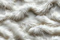 Luxurious white faux fur texture background with soft wavy pattern, perfect for fashion, interior design, and luxury product presentations. Elegant fluffy surface creates depth and dimension.