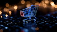 Glowing blue shopping cart icon on digital circuit board with bokeh lights background represents online retail and e-commerce technology concept.
