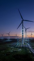 Wind turbines with digital grid overlay at sunset, representing renewable energy technology and smart power distribution for sustainable electricity generation and green energy concepts.