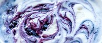 Swirled purple and white marble texture with fluid abstract patterns, suitable for backgrounds, wallpapers, and design overlays.