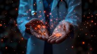 Glowing orange network particles floating above cupped hands against dark background with blue light, representing digital transformation and connectivity.