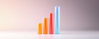 Growing bar chart columns in orange and blue colors on light background showing business progress and financial growth statistics analysis.