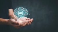 Hands holding glowing AI brain with circuit patterns representing artificial intelligence technology and machine learning innovation for business solutions.