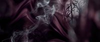Dark mystical smoke swirls with ornate tribal tattoo design on skin creating atmospheric gothic mood for fantasy and spiritual concepts.