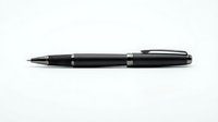Black ballpoint pen with silver accents isolated on white background for business and office design projects.