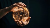 Hands protecting glowing digital network sphere with connected nodes and light effects on dark background for technology and innovation concepts.