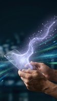 Hand holding smartphone with glowing circuit board patterns and digital data streams flowing outward, representing technology innovation, connectivity, and digital transformation for business applications.