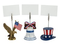 Patriotic memo holders with blank cards, featuring golden eagle, nautical bell, and stars and stripes top hat designs. Perfect for offices, events, and patriotic displays.