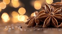 Star anise pods on dark surface with golden bokeh lights in background, aromatic spice macro photography for culinary and seasonal designs.