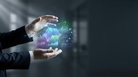 Businessman hands protecting holographic data analytics charts and graphs representing digital transformation and business intelligence solutions.