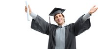 Joyful male graduate in cap and gown celebrating academic achievement with diploma in hand, arms raised in triumph against white background.