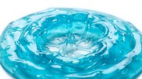 Turquoise water droplet splash with ripples and waves on white background, suitable for cosmetics, skincare, beverage, and wellness product packaging design.