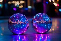 Glowing glass spheres with magical purple and blue reflections against dark background, creating dreamy bokeh effect and mystical atmosphere.