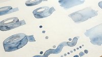 Watercolor blue paint strokes and drops on white paper background for artistic design projects and creative layouts.