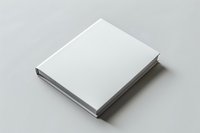 Blank white hardcover book mockup on neutral background for branding and design presentation projects.