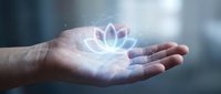 Cupped hands holding glowing lotus flower symbol with ethereal light effects representing spiritual wellness, meditation, and inner peace concepts.