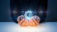 Professional businessman cupping hands presenting glowing digital brain with network connections and light particles for technology and artificial intelligence concepts.