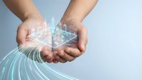 Two hands cupped together holding glowing digital cityscape with flowing data streams, representing technology innovation, smart city development, and digital transformation for business solutions.