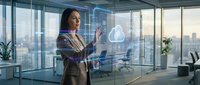 Professional businesswoman interacting with holographic cloud computing interface in modern glass office, showcasing digital transformation and data management.