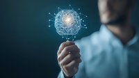 Caucasian businessman holding glowing digital network sphere, representing global connectivity and innovative technology solutions in dark background.