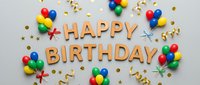 Happy birthday flat lay with colorful balloons, golden confetti, and festive streamers on a light gray background for party celebration.