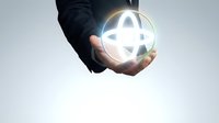 Male hand in dark business suit holding glowing globe symbol representing global connectivity, international commerce, and worldwide network communication for corporate and technology concepts.