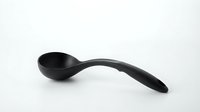 Black serving spoon with curved handle on white background, suitable for kitchen, cooking, and tableware design projects.