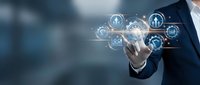 Businessman touching digital interface with human resources icons and network connections for modern HR management and recruitment technology solutions.