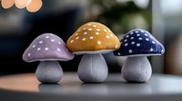 Decorative mushroom ornaments in purple, orange and navy blue with polka dot patterns on gray stems, arranged in row on blurred background.