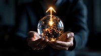 Businessman holding glowing crystal ball with golden light and sparkles representing innovation, future vision, and magical business solutions.
