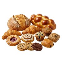 Assorted fresh baked goods including croissants, bread rolls, pastries, muffins and cookies isolated on white background for bakery, cafe and food design projects.