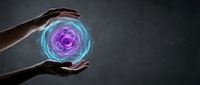 Hands protecting glowing purple and blue energy sphere with swirling light patterns against dark background for healing and spiritual wellness concepts.