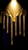 Golden honey dripping down in streams against dark background with warm glowing light and sparkling particles creating luxury food concept.