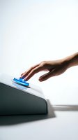 Hand of person with medium skin tone pressing blue button on device, representing technology interaction, user engagement, and digital control for web and app design.
