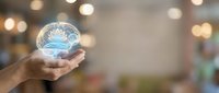 Hand holding glowing brain hologram with neural networks against blurred bokeh background representing artificial intelligence and mental health concepts.