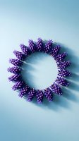 Purple lavender flowers arranged in circular wreath formation on soft blue gradient background with gentle shadows creating elegant floral frame composition.