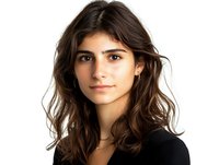Young professional woman with wavy brown hair and natural makeup smiling confidently at camera on white background isolated for business design.