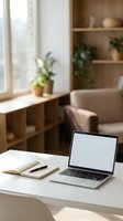 Modern home office workspace with open laptop and notebook on white desk in bright living room with plants and natural light for remote work.