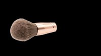 Makeup brush with soft natural bristles and rose gold metal handle isolated on transparent background, ready for beauty product design, cosmetics packaging, and print-on-demand applications.