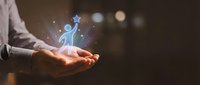 Business professional holding glowing human figure with star above palm representing success, achievement, leadership development and career growth concept.
