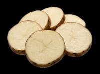 Sliced raw potato rounds arranged in a fan, isolated on transparent background, ready for food design, stickers, print on demand, clipart, and T-shirt use.