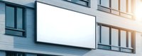 Blank white rectangular billboard mockup mounted on modern office building facade with glass windows and sunlight effect. For advertising display.