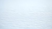 Fresh snow surface with pristine white texture and natural sparkle, winter landscape background for seasonal designs and cold weather concepts.