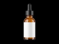 Amber glass dropper bottle with blank white label, isolated on transparent background, ready for cosmetic branding, packaging mockups, and print on demand design use.